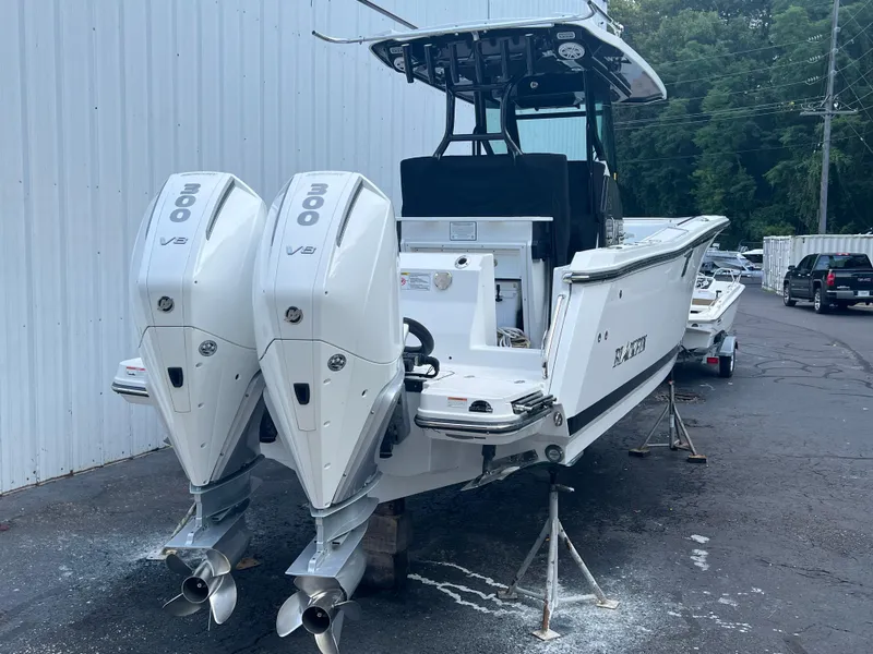 Slide: The Image of 2020 Blackfin 272 CC boat with twin 300 V8 engines on a trailer. - 30