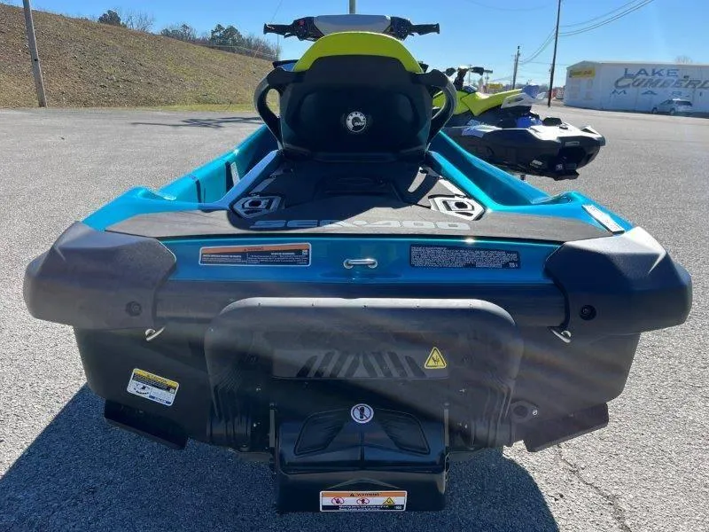 Slide: The Image of 2024 Sea-Doo GTI SE 130 IBR jet ski, rear view, parked on pavement. - 27