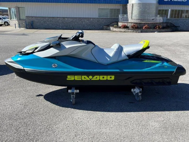Slide: The Image of 2024 Sea-Doo GTI SE 130 IBR jet ski in a parking lot. - 3