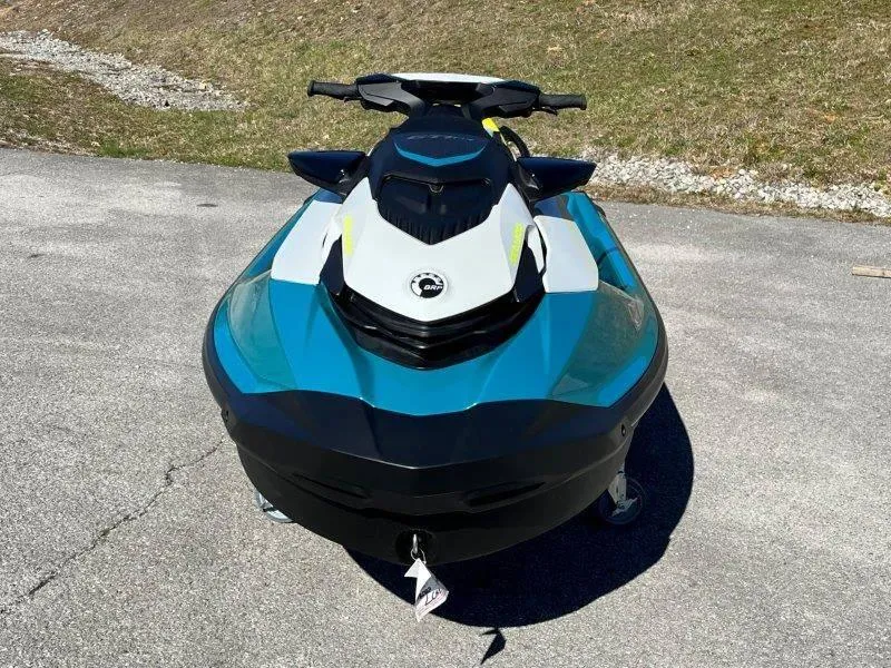 Slide: The Image of 2024 Sea-Doo GTI SE 130 IBR jet ski on pavement, front view. - 37