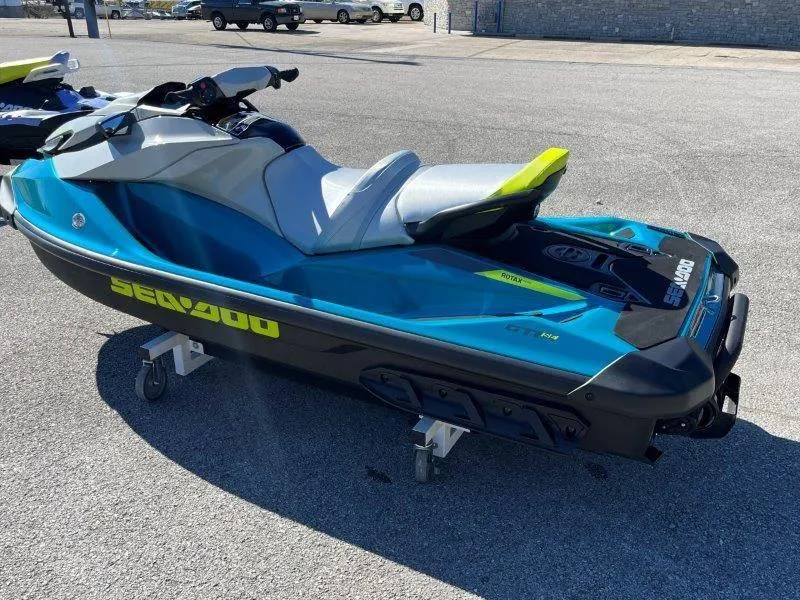 Slide: The Image of 2024 Sea-Doo GTI SE 130 IBR jet ski in vibrant blue on display. - 4