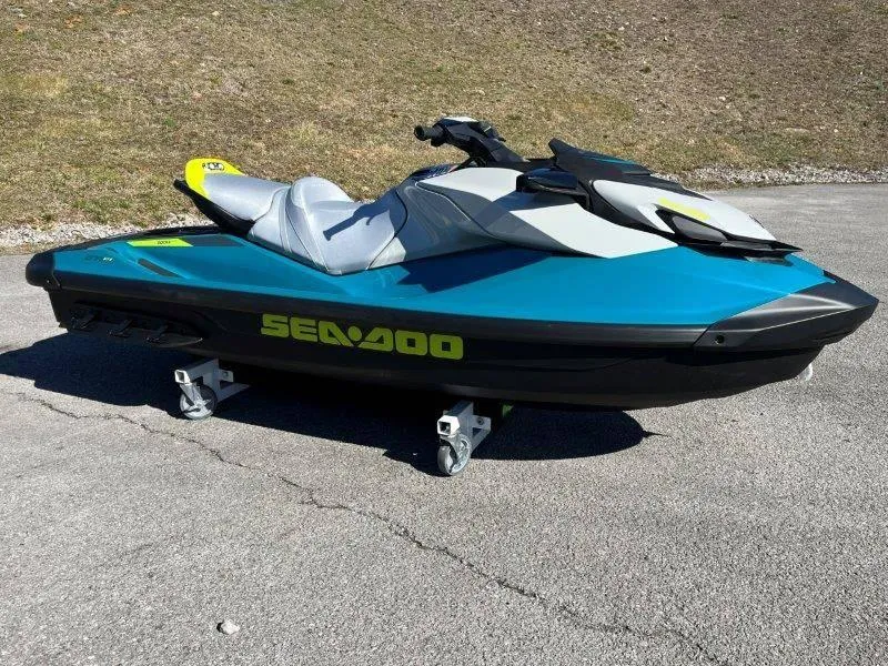 Slide: The Image of 2024 Sea-Doo GTI SE 130 IBR jet ski on pavement, vibrant blue and gray design. - 8