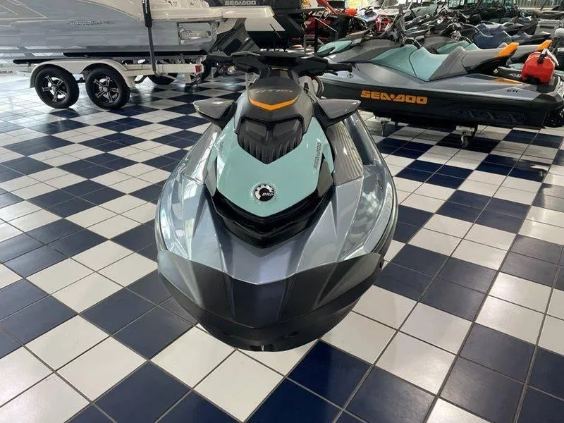 Slide: The Image of 2024 Sea-Doo GTI SE 130 IBR jet ski displayed in showroom. - 15