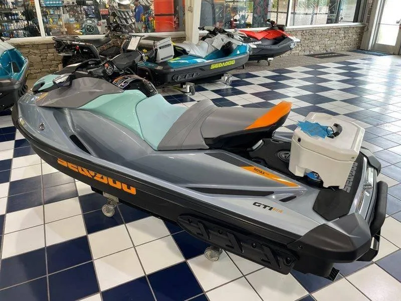 Slide: The Image of 2024 Sea-Doo GTI SE 130 IBR jet ski displayed in showroom. - 21
