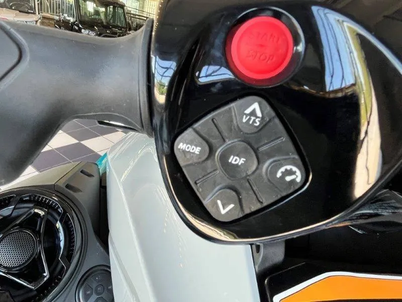 Slide: The Image of Close-up of 2024 Sea-Doo GTI SE 130 iBR controls with start/stop button and mode settings. - 11