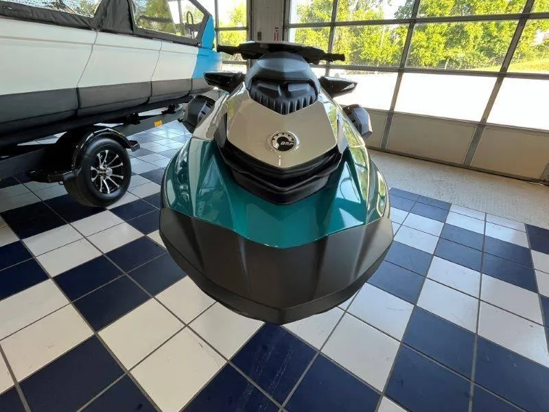 Slide: The Image of 2024 Sea-Doo GTI SE 130 jet ski in showroom, featuring iBR Tech and audio system. - 17