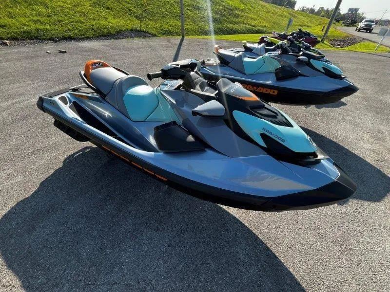Slide: The Image of 2024 Sea-Doo GTI SE 130 jet skis parked on asphalt, featuring iBR Tech and audio system. - 13
