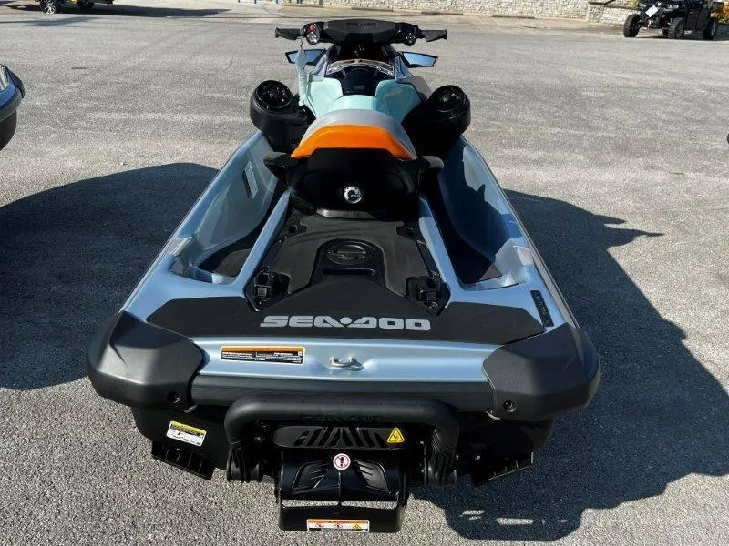 Slide: The Image of 2024 Sea-Doo GTI SE 130 iBR jet ski, rear view, parked on pavement. - 14