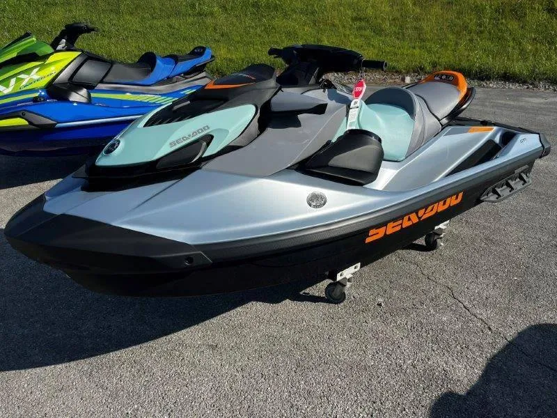 Slide: The Image of 2024 Sea-Doo GTI SE 130 jet ski with iBR Tech, Audio, iDF features, parked outdoors. - 4