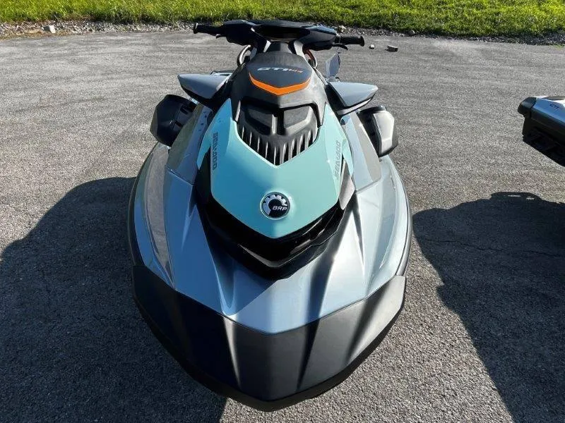 Slide: The Image of 2024 Sea-Doo GTI SE 130 iBR Tech with audio and iDF features, parked on pavement. - 5