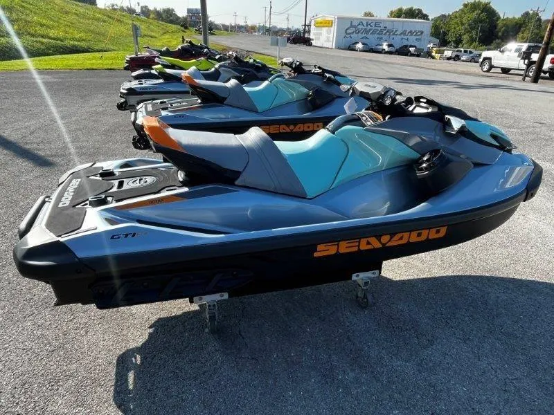Slide: The Image of 2024 Sea-Doo GTI SE 130 jet skis lined up outdoors, showcasing sleek design and features. - 6