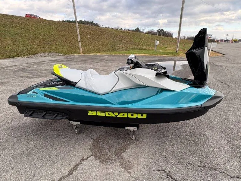 Slide: The Image of 2024 Sea-Doo GTI SE 170 IBR jet ski on pavement, showcasing sleek design and vibrant colors. - 10