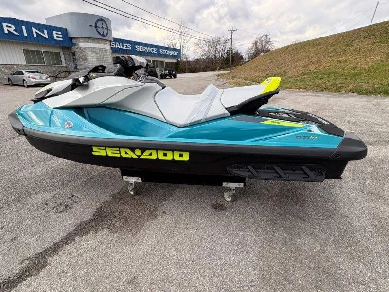 Slide: The Image of 2024 Sea-Doo GTI SE 170 IBR jet ski in a parking lot, side view. - 16
