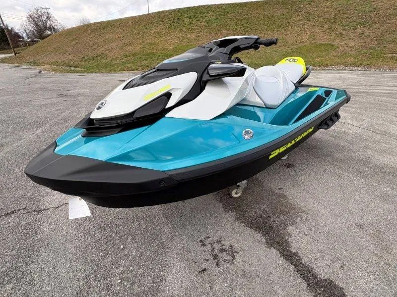 Slide: The Image of 2024 Sea-Doo GTI SE 170 IBR jet ski in vibrant blue and black design. - 18