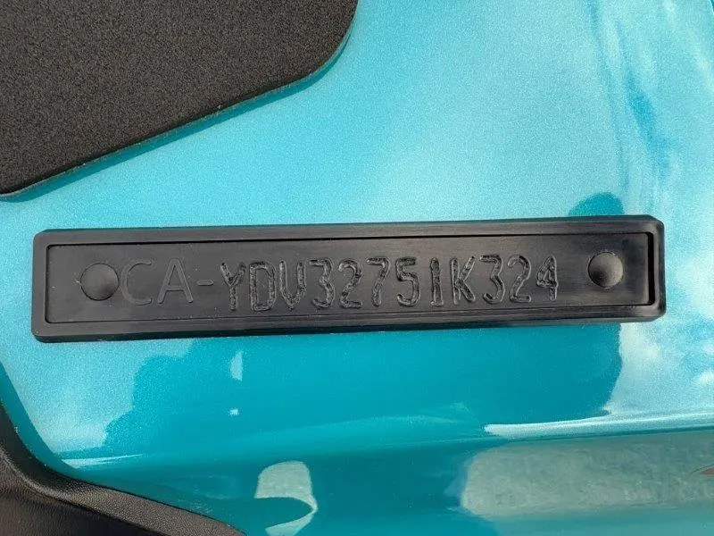 Slide: The Image of 2024 Sea-Doo GTI SE 170 IBR hull identification number on teal surface. - 20