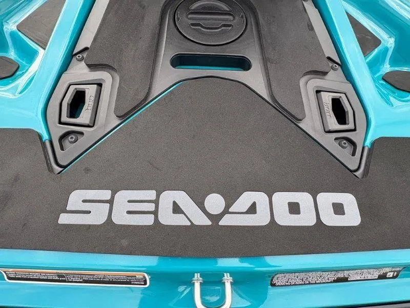 Slide: The Image of 2024 Sea-Doo GTI SE 170 IBR rear deck with logo and teal accents. - 4