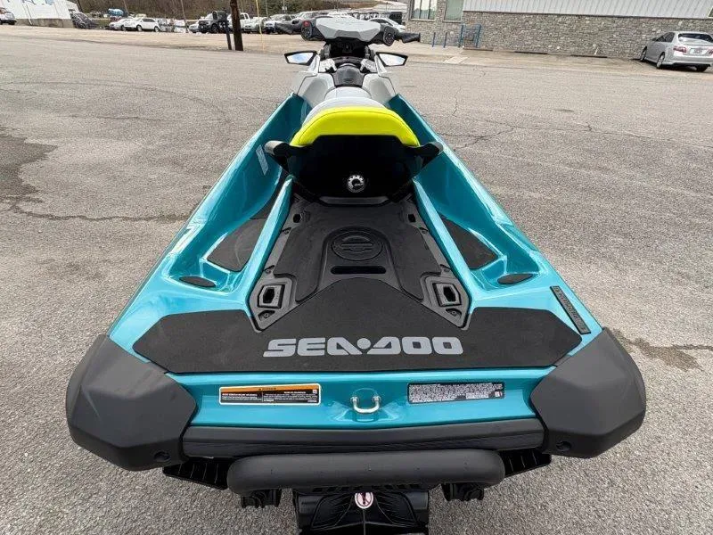 Slide: The Image of 2024 Sea-Doo GTI SE 170 IBR jet ski, rear view, vibrant blue color. - 6