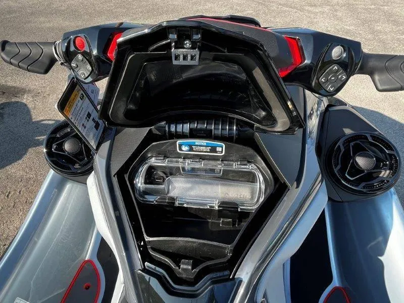 Slide: The Image of 2024 Sea-Doo RXT-X 325 dashboard and storage compartment, Ice Metal/Manta Green. - 10