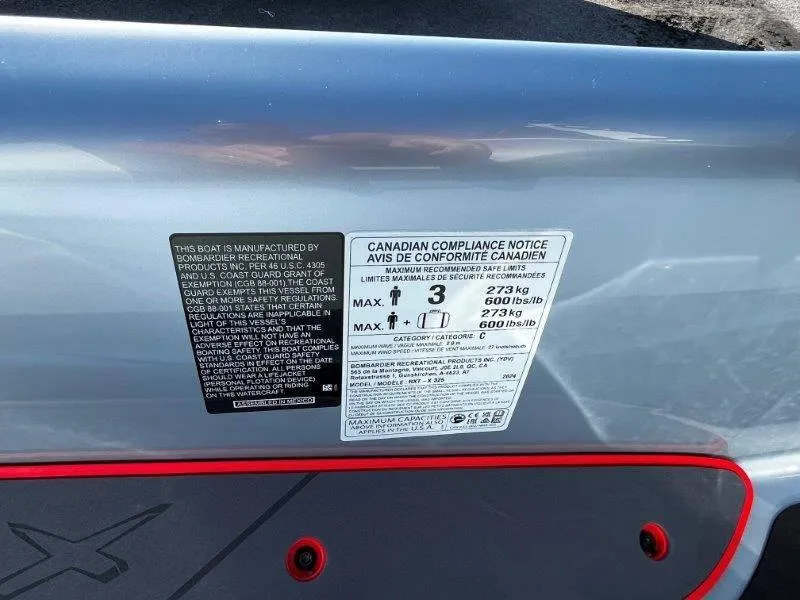 Slide: The Image of 2024 Sea-Doo RXT-X 325 compliance labels, Ice Metal/Manta Green model, safety and capacity details. - 20