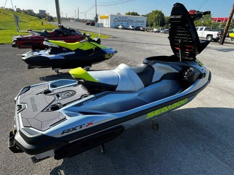 Slide: The Image of 2024 Sea-Doo RXT-X 325 in Ice Metal/Manta Green on display outdoors. - 25