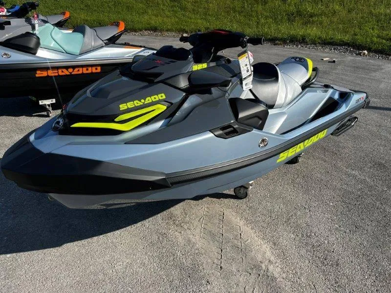 Slide: The Image of 2024 Sea-Doo RXT-X 325 in Ice Metal and Manta Green on display. - 28