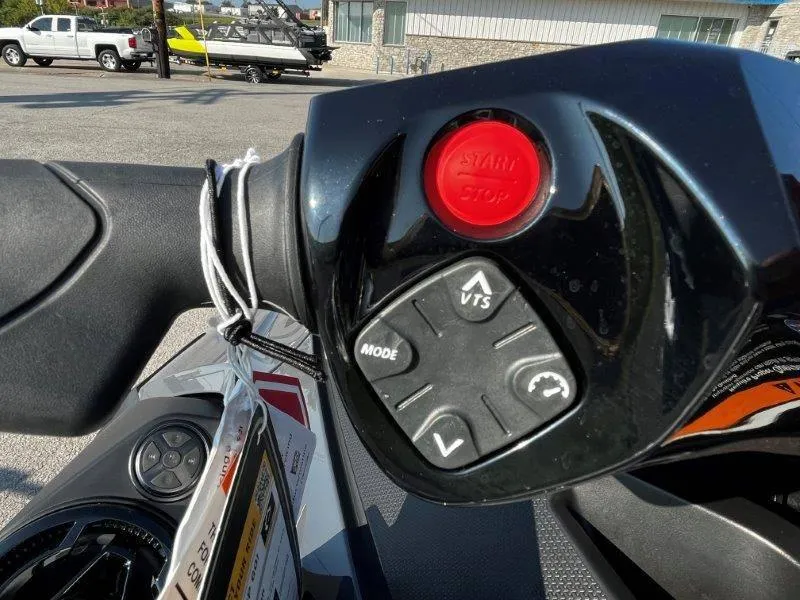 Slide: The Image of Close-up of 2024 Sea-Doo RXT-X 325 handlebar controls, featuring start/stop button and VTS mode. - 29