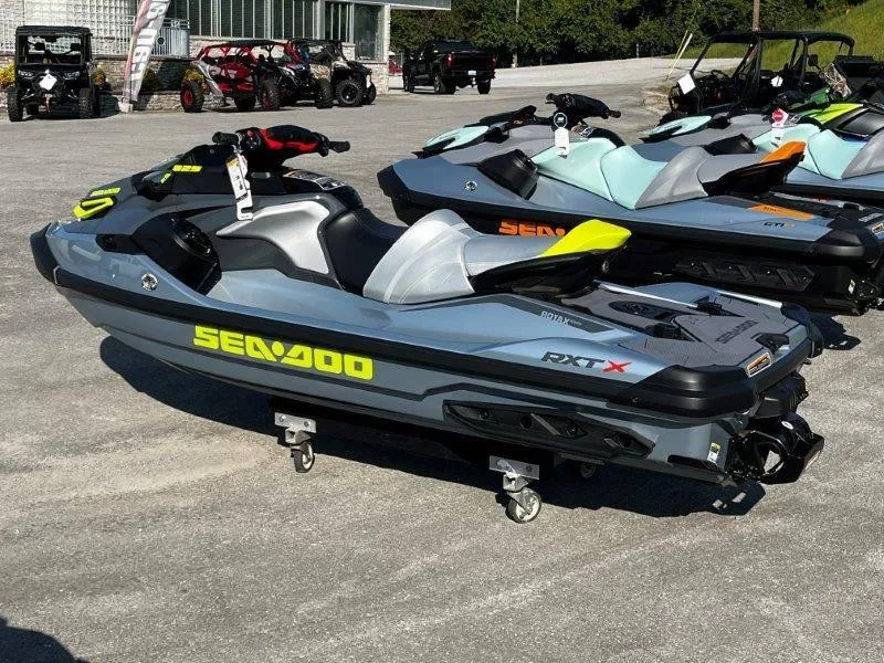 Slide: The Image of 2024 Sea-Doo RXT-X 325 in Ice Metal and Manta Green on display. - 3