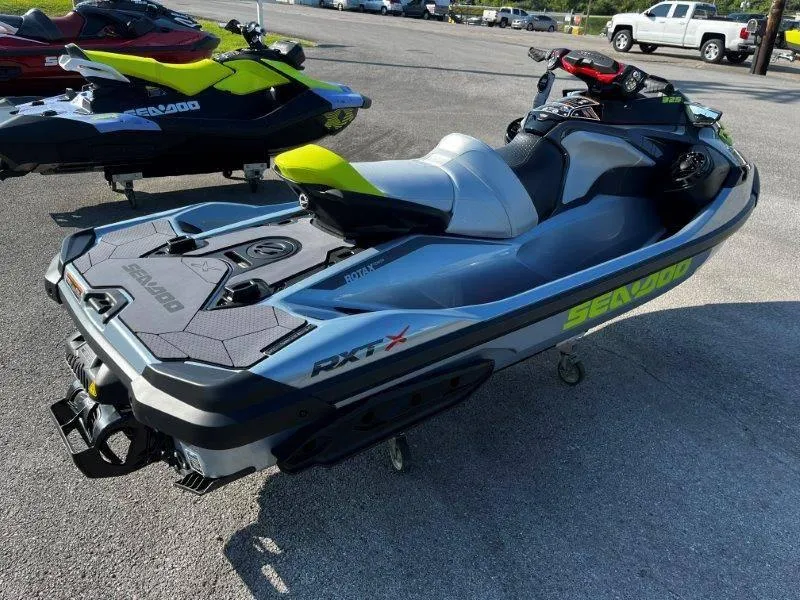 Slide: The Image of 2024 Sea-Doo RXT-X 325 in Ice Metal and Manta Green on display. - 9