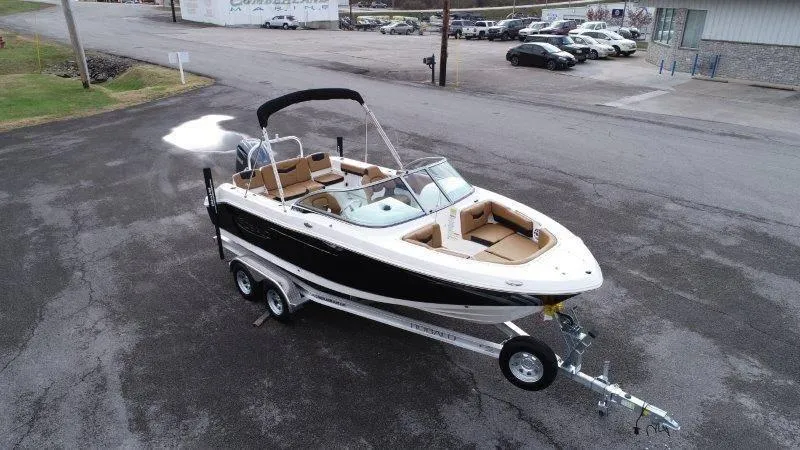 Slide: The Image of 2024 Robalo R207 boat on trailer in parking lot, aerial view. - 10