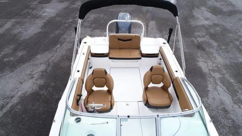 Slide: The Image of 2024 Robalo R207 boat interior with tan seating and sleek design. - 15
