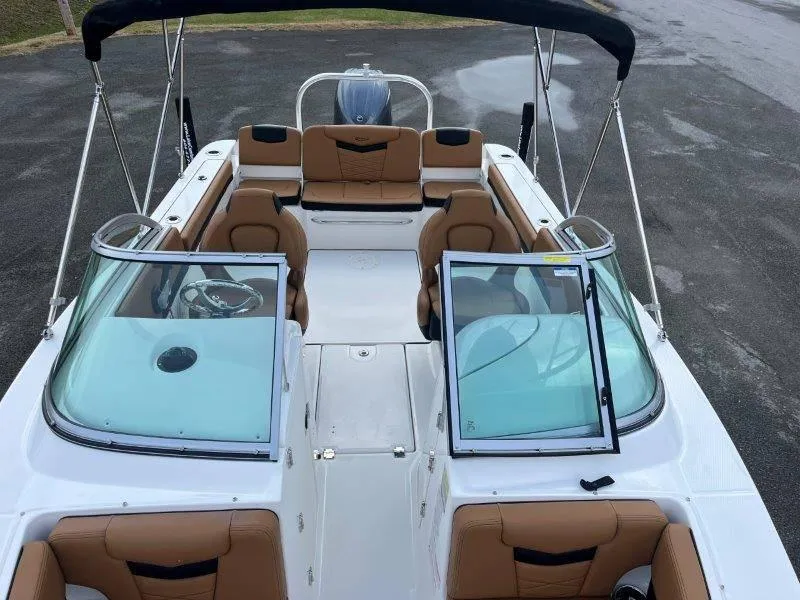 Slide: The Image of 2024 Robalo R207 boat interior with tan seating and open windshield. - 16