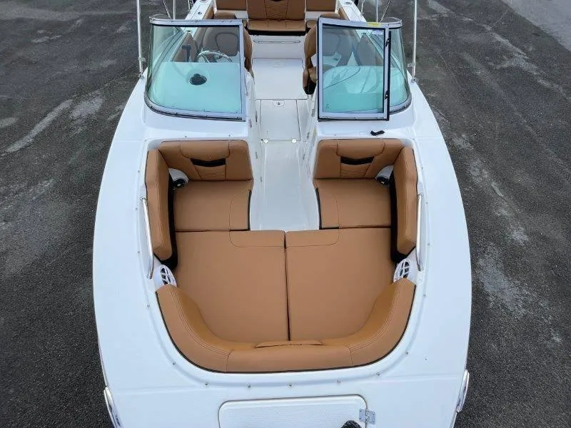 Slide: The Image of 2024 Robalo R207 boat with tan seating and dual windshields. - 17