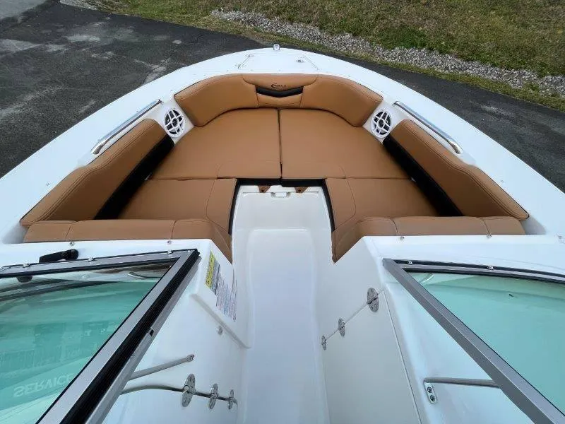 Slide: The Image of 2024 Robalo R207 boat interior with tan seating and white accents. - 18