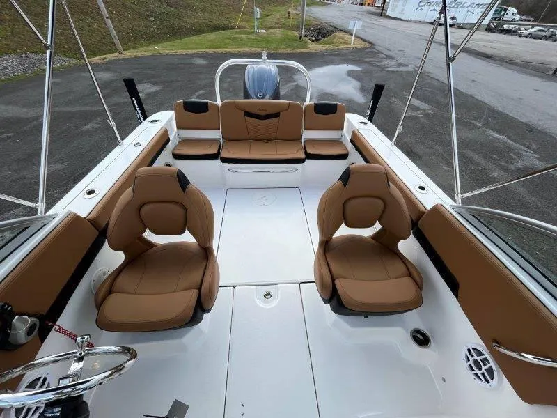 Slide: The Image of 2024 Robalo R207 boat interior with tan seating and modern design. - 24