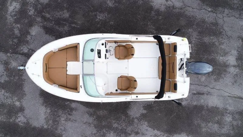 Slide: The Image of 2024 Robalo R207 boat, aerial view, white hull, tan seating, outboard motor. - 3