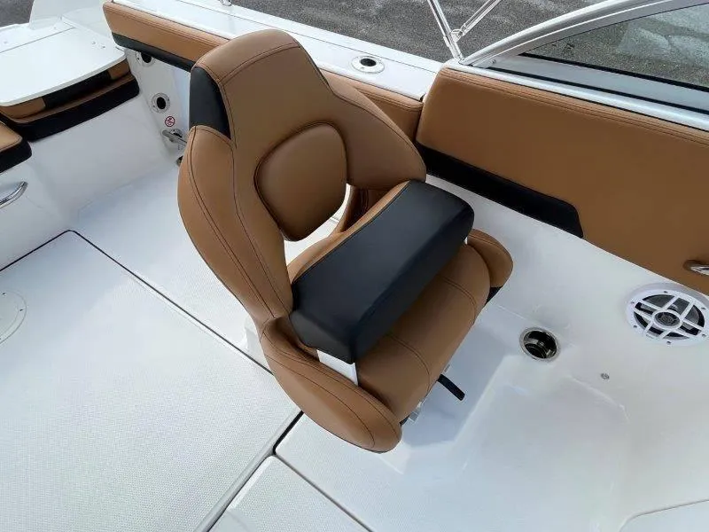 Slide: The Image of 2024 Robalo R207 boat interior with tan and black seating. - 37