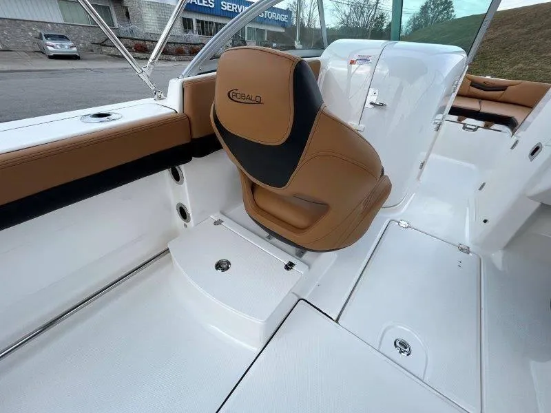 Slide: The Image of 2024 Robalo R207 boat interior with tan seating and white deck. - 39