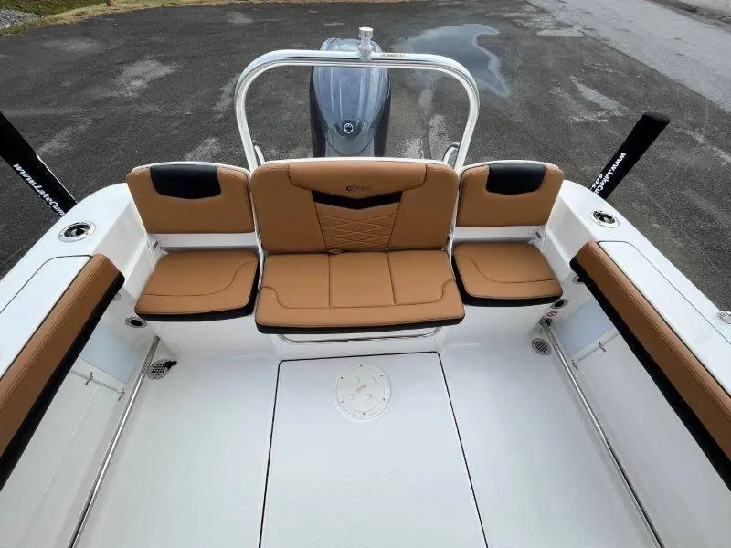 Slide: The Image of 2024 Robalo R207 boat interior with tan seating and sleek design. - 42