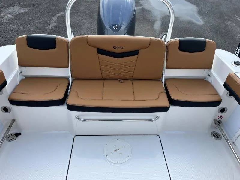 Slide: The Image of 2024 Robalo R207 boat with tan and black seating, rear view. - 43