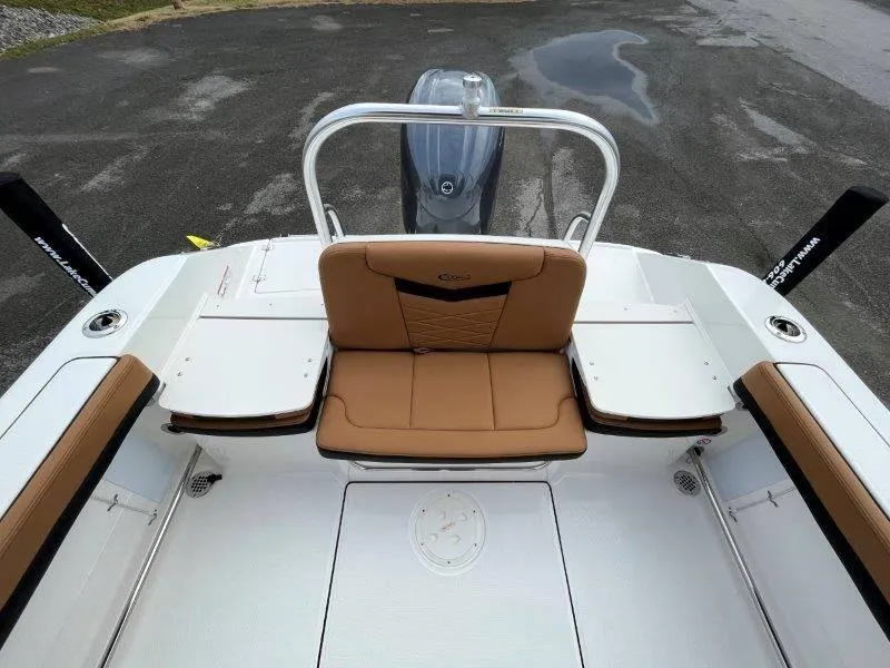 Slide: The Image of 2024 Robalo R207 boat interior with tan seating and sleek design. - 44