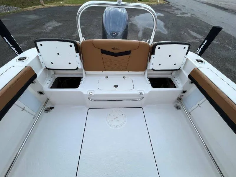 Slide: The Image of 2024 Robalo R207 boat interior with storage compartments and seating. - 45