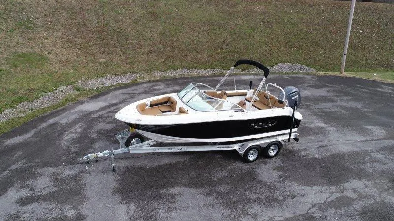 Slide: The Image of 2024 Robalo R207 boat on trailer, parked on asphalt. - 7