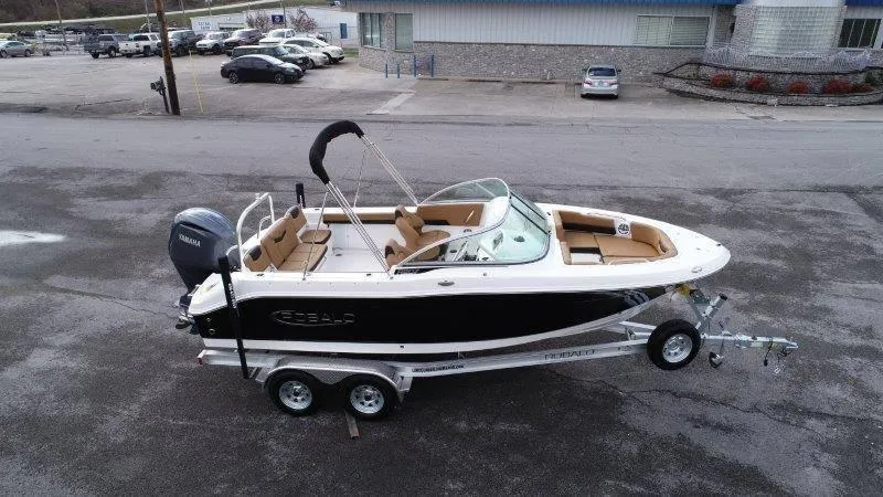 Slide: The Image of 2024 Robalo R207 boat on trailer in parking lot. - 9