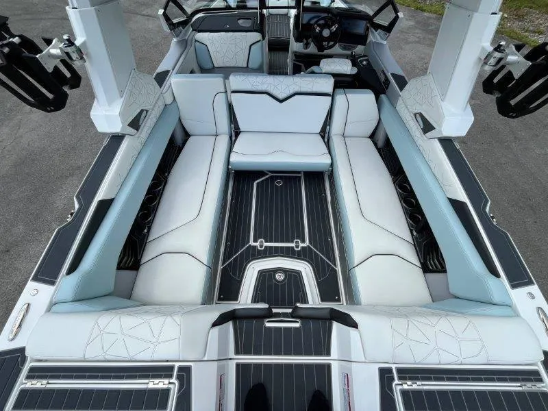 Slide: The Image of 2020 Nautique Paragon P25 interior with luxurious seating and sleek design. - 21