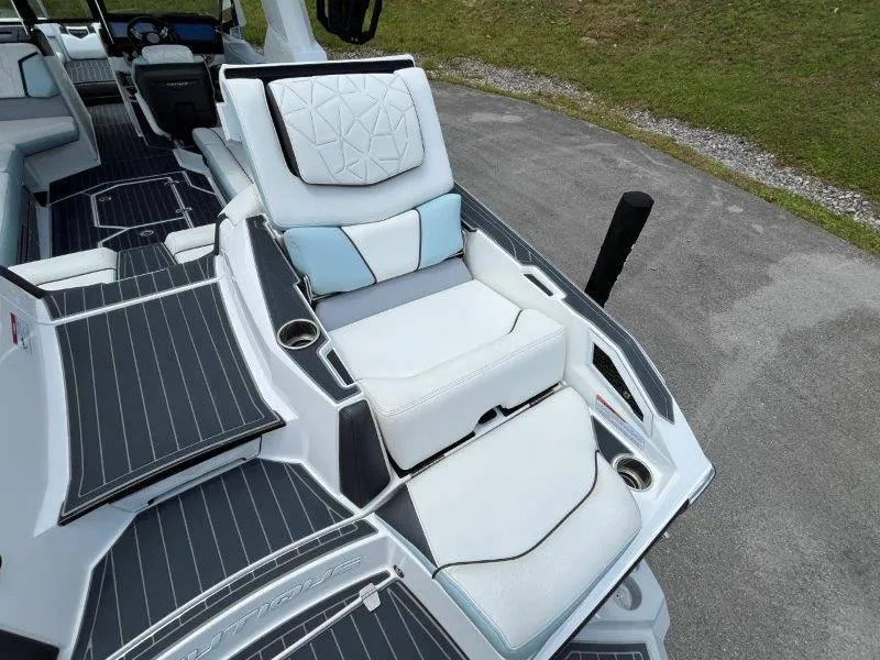 Slide: The Image of 2020 Nautique Paragon P25 boat interior with luxurious seating and sleek design. - 22