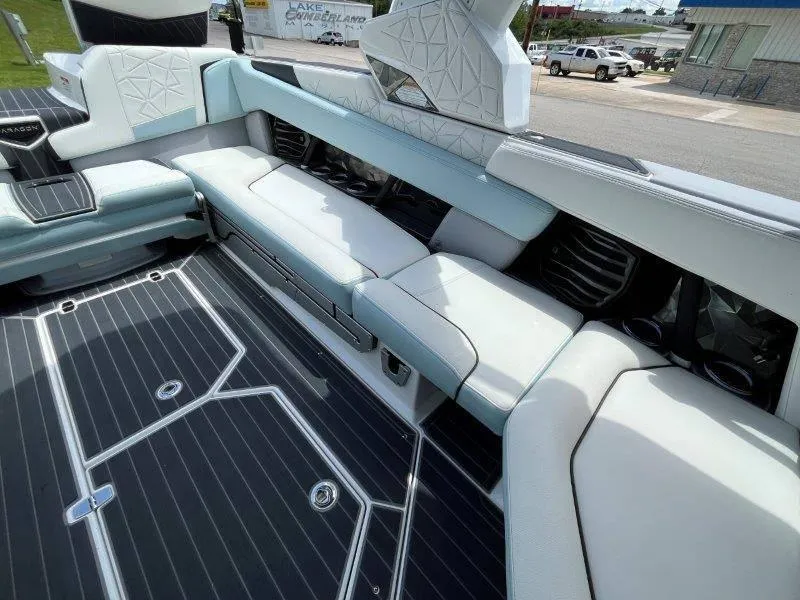 Slide: The Image of Interior of 2020 Nautique Paragon P25 boat with luxurious seating and sleek flooring. - 29
