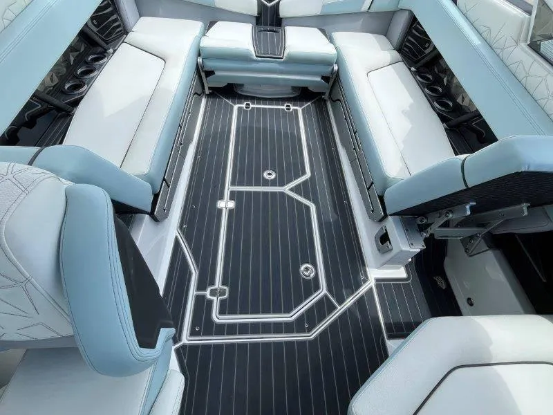 Slide: The Image of 2020 Nautique Paragon P25 interior with sleek seating and modern flooring design. - 32