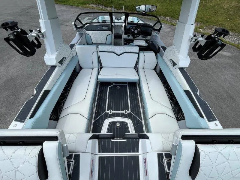 Slide: The Image of Interior of 2020 Nautique Paragon P25 boat with luxurious seating and sleek design. - 33