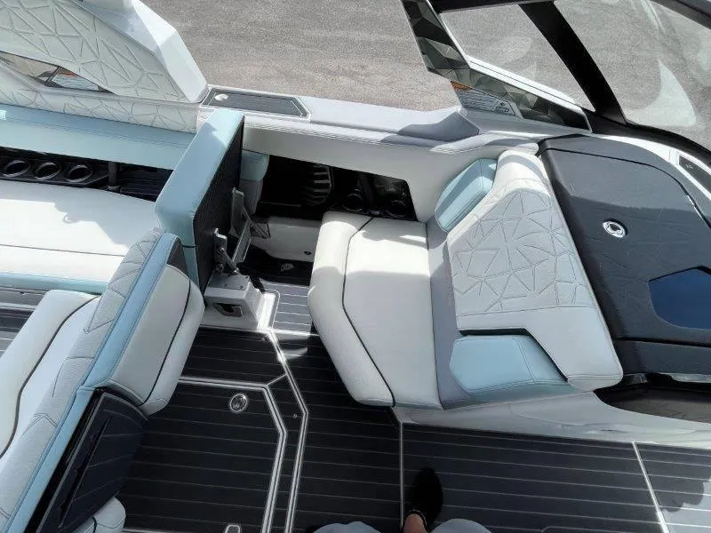 Slide: The Image of Interior of 2020 Nautique Paragon P25 boat with luxurious seating and modern design. - 34