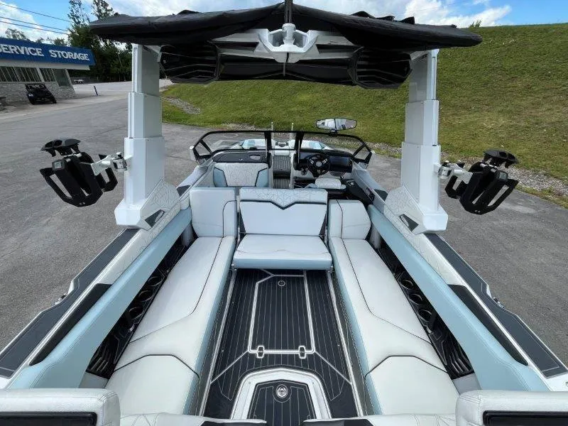 Slide: The Image of 2020 Nautique Paragon P25 boat interior with luxurious seating and advanced features. - 36
